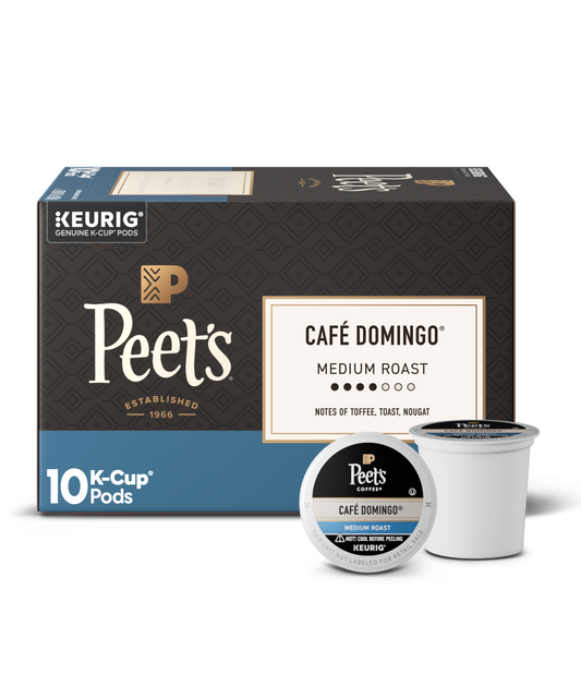 Box of Peet's Cafe Domingo K-Cup pods with two pods on a white background