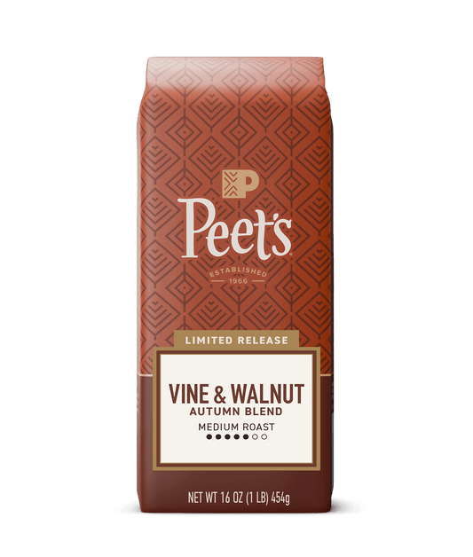 Peet's Vine & Walnut Autumn Blend coffee bag in a limited release medium roast, 16 oz. The packaging features a terracotta patterned background with a cream and brown label at the bottom, set against a solid dark green background.