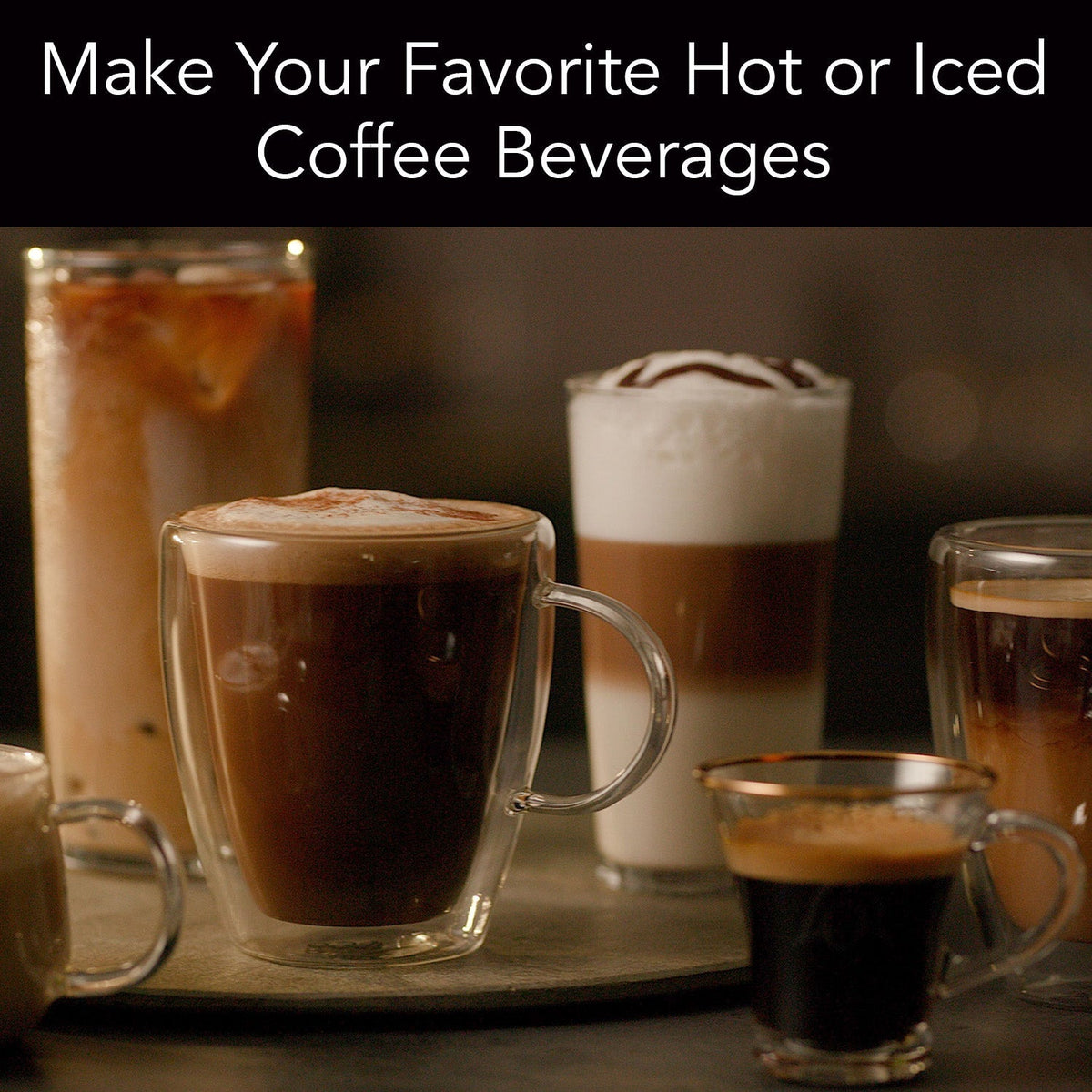 Various coffee beverages including a mocha, cappuccino, and iced coffee on a wooden tray.